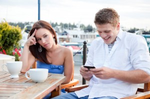 Using a phone on a date has become accepted even though it may not be tolerated.